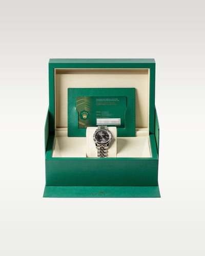 An open iconic green Rolex luxury watch presentation box displaying the brand new Datejust 31 278274 watch inside