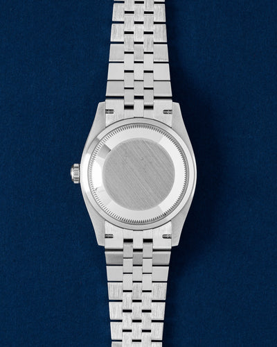 Rear studio view of the 36mm White Rolesor Rolex Datejust case showing the solid brushed caseback and five-link Jubilee stainless steel bracelet links