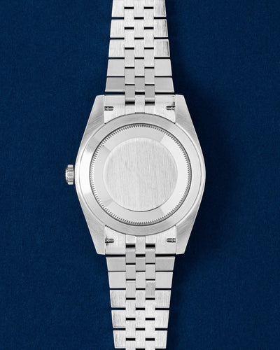 The solid Oystersteel caseback and classic 5-link Jubilee bracelet profile view of a 41mm Rolex Datejust