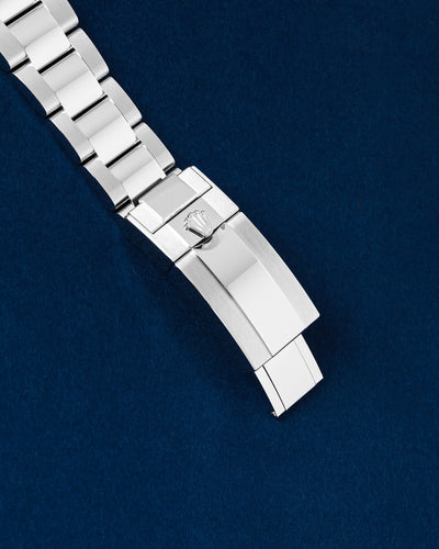 Close-up of the polished and brushed Oystersteel folding Oysterlock safety clasp on a brand new Rolex Daytona bracelet
