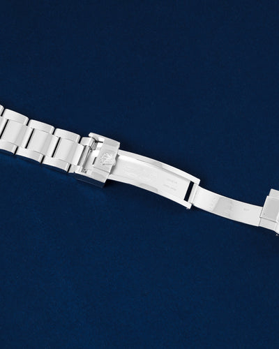 Detailed view of the open solid platinum folding deployment buckle showing the internal clasp mechanisms on a Rolex Daytona bracelet