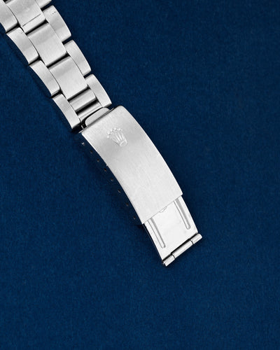 Close-up of the period-correct brushed stainless steel folding Oyster clasp with embossed coronet on a 1979 vintage Rolex Daytona 6265