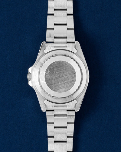 40mm stainless steel vintage Rolex Explorer case showing the smooth brushed caseback and satin-finished Oyster bracelet links