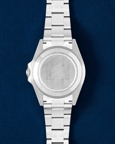 Oystersteel screw-down caseback on a 42mm Rolex Explorer II luxury sports watch