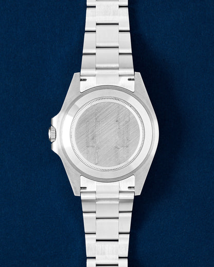 Oystersteel screw-down caseback on a 42mm Rolex Explorer II luxury sports watch