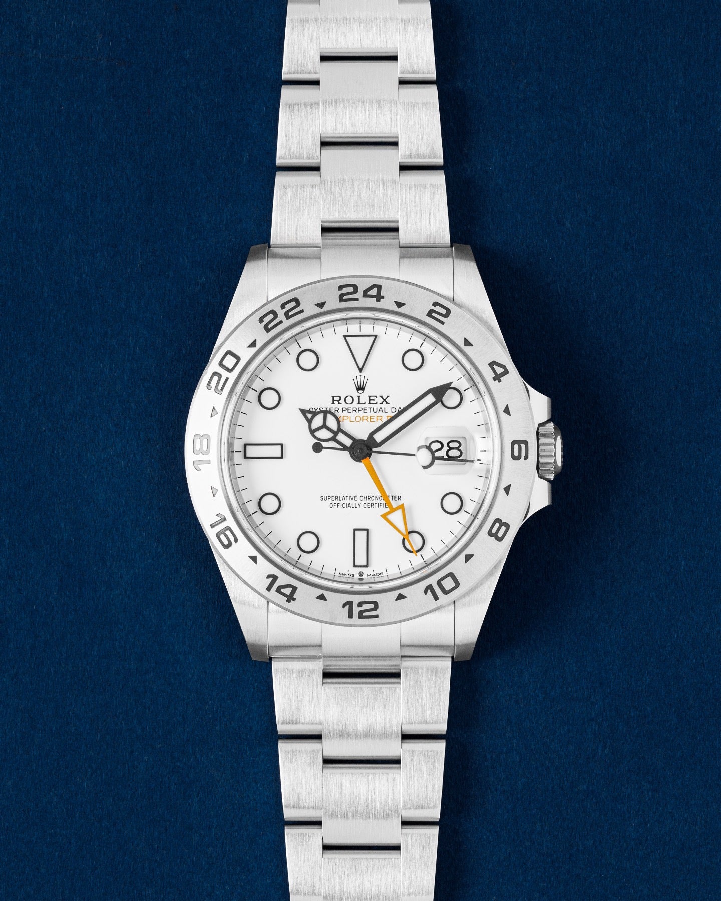 Rolex Explorer II Polar watch featuring a stark white dial, orange GMT hand, fixed steel 24-hour bezel and an Oyster bracelet