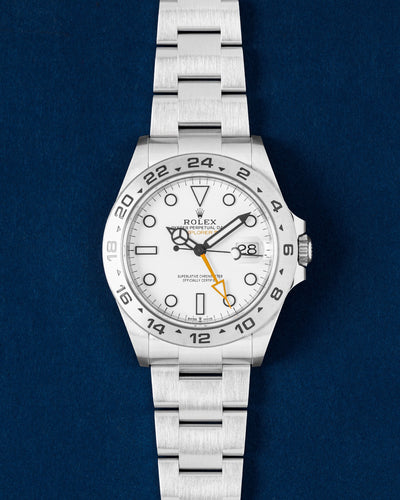 Rolex Explorer II Polar watch featuring a stark white dial, orange GMT hand, fixed steel 24-hour bezel and an Oyster bracelet