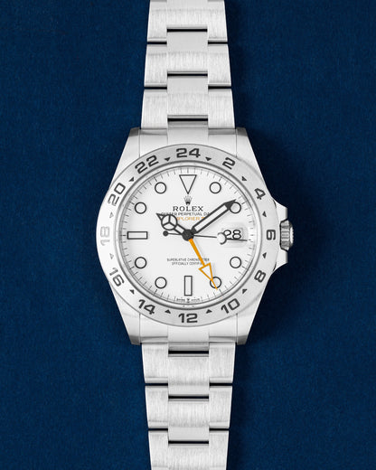 Rolex Explorer II Polar watch featuring a stark white dial, orange GMT hand, fixed steel 24-hour bezel and an Oyster bracelet