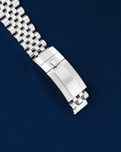 Close-up view of the closed stainless steel Oysterlock safety clasp on a pre-owned Rolex Jubilee watch bracelet