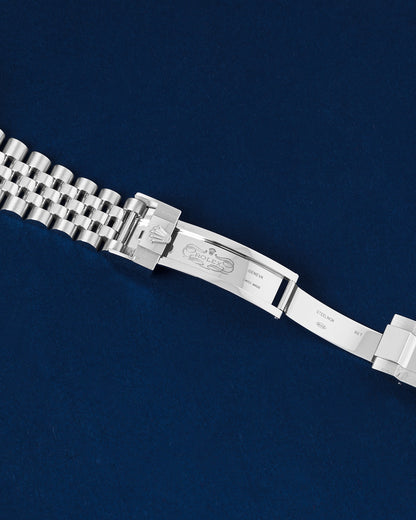 Detailed view of the open folding deployment buckle showing the 5mm Easylink comfort extension link on a steel Rolex Jubilee bracelet