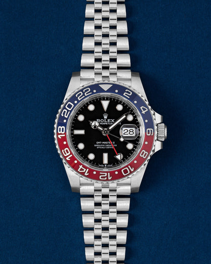 Pre owned 2022 Rolex GMT-Master II 126710BLRO Pepsi red and blue ceramic bezel watch on a Jubilee bracelet at Grand Caliber Dallas