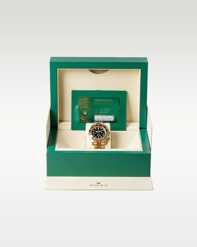 Pre owned 2024 Rolex GMT-Master II 126718GRNR 18k yellow gold complete full set with original green luxury presentation watch box