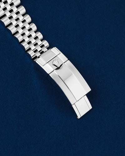 Close-up of the polished and brushed Oystersteel folding Oysterlock safety clasp on a modern Rolex GMT Sprite Jubilee bracelet