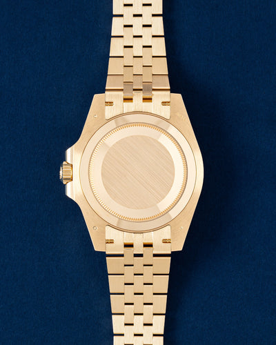 Solid 18k yellow gold screw-down Oyster caseback on an unworn Rolex GMT-Master II Zombie watch