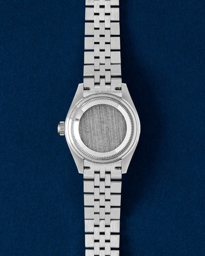 Solid screw-down brushed stainless steel Oyster caseback view on a pre-owned 28mm Rolex Lady-Datejust model