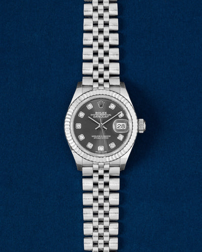 Pre owned 2017 Rolex Lady-Datejust 28mm 279174 steel and 18k white gold fluted bezel watch with factory dark grey diamond dial on a Jubilee bracelet at Grand Caliber Dallas