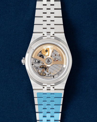 Transparent sapphire caseback view displaying the automatic caliber 7135 movement on an unworn Rolex Land-Dweller 40