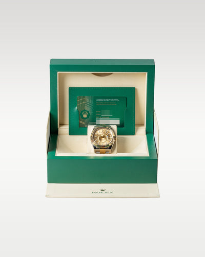 An open iconic green Rolex luxury watch presentation box displaying the 2021 two-tone Sky-Dweller 326933 watch inside