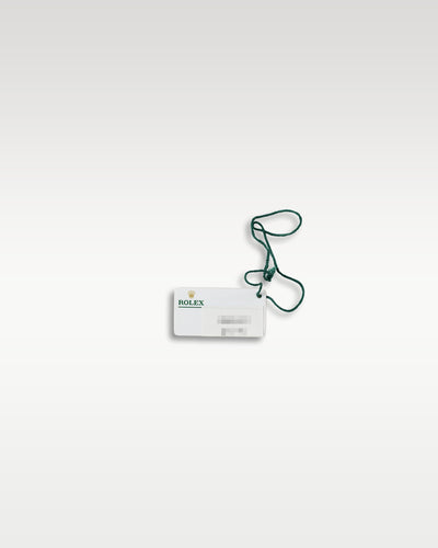 official white rectangular Rolex paper hangtag showing the barcode, serial, and reference number 336934