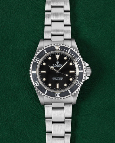 1996 black dial Rolex Submariner 14060 | Grand Caliber Watches