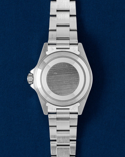 Solid screw-down brushed stainless steel oyster caseback view of a neo-vintage Rolex Submariner tool watch