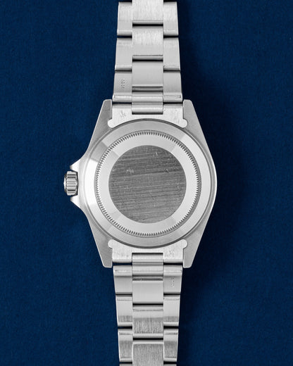 Solid screw-down brushed stainless steel oyster caseback view of a neo-vintage Rolex Submariner tool watch