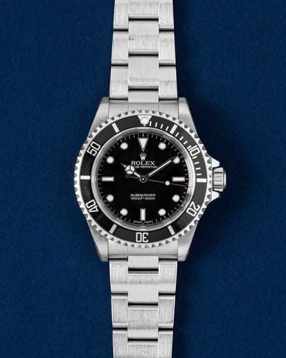 Pre-owned 2007 Rolex Submariner No-Date 14060M 40mm stainless steel dive watch at Grand Caliber Dallas