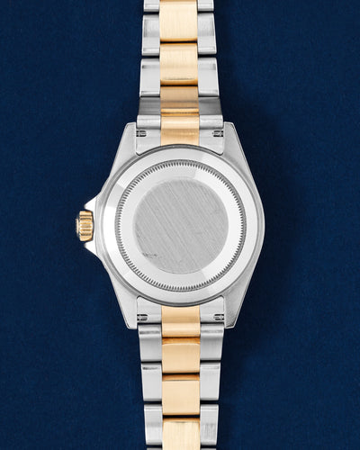 Solid screw-down brushed Oystersteel caseback view on a neo-vintage two-tone Rolex Submariner Bluesy