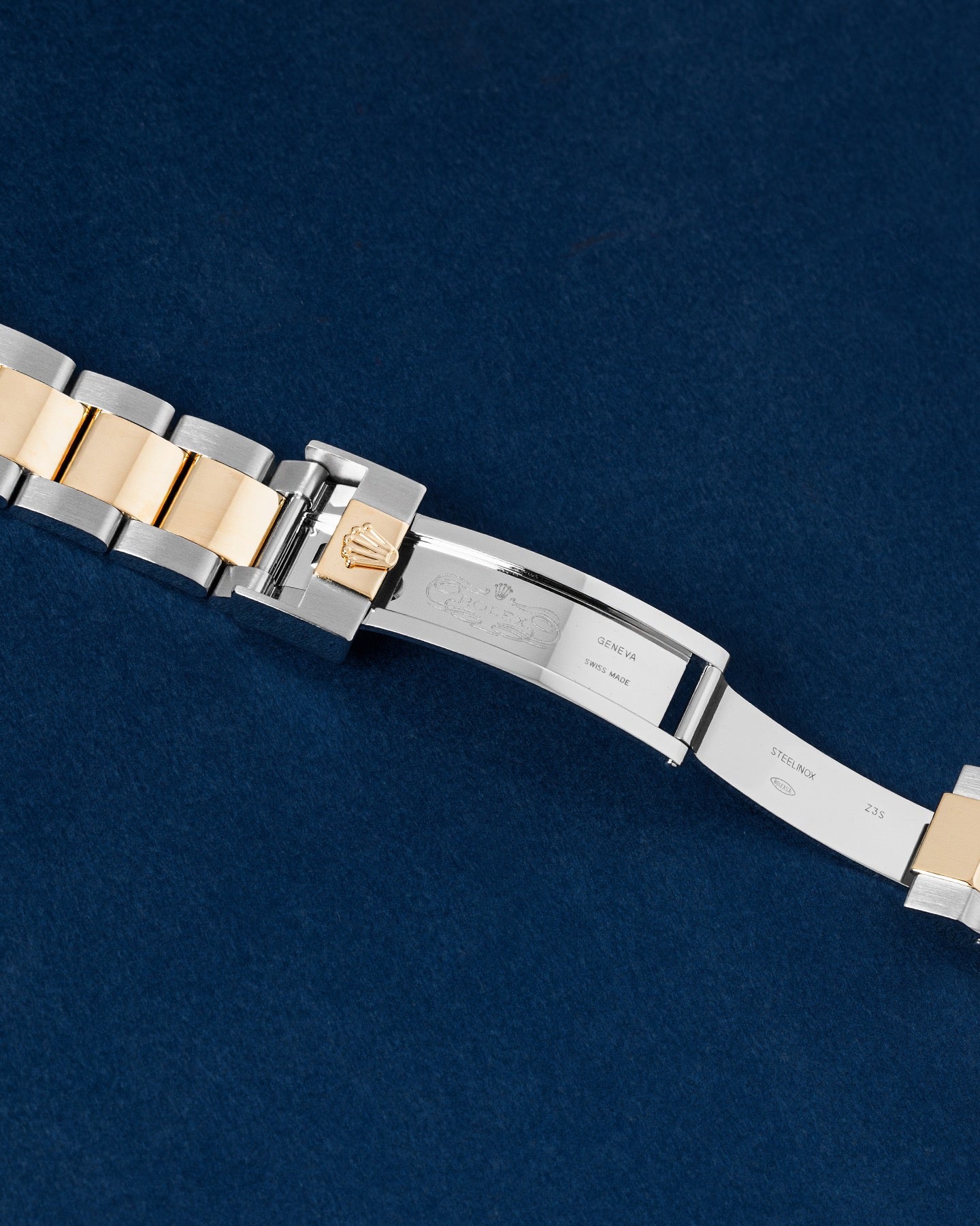open two-tone Rolex Oysterlock clasp showing the inner deployant blades and the Glidelock fine-adjustment expansion system