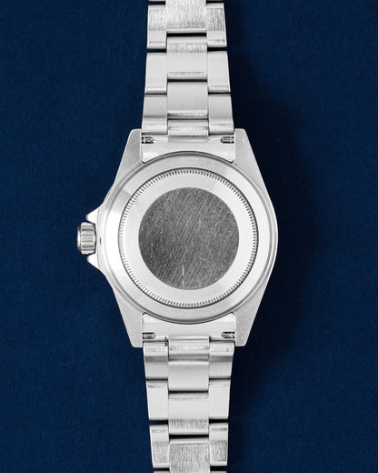 Rear view of the 40mm Rolex Submariner case showcasing the brushed steel caseback and solid end link Oyster bracelet configuration