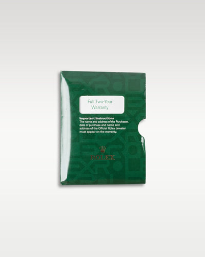 top-down overview of the classic green grained leather Rolex wallet sleeve used for holding the warranty certificate paper