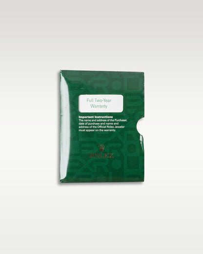 top-down overview of the classic green grained leather Rolex wallet sleeve used for holding the warranty certificate paper