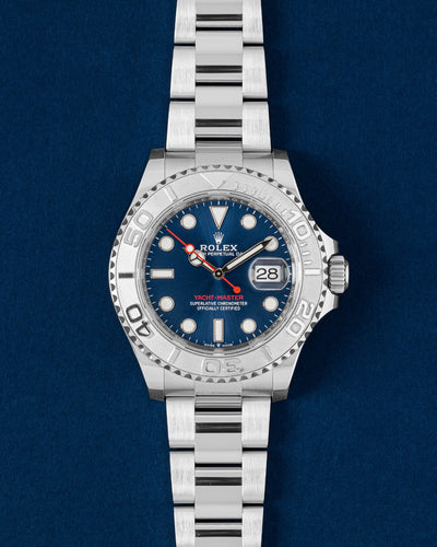 Pre owned 2023 Rolex Yacht-Master 40 126622 Rolesium watch with sandblasted 950 platinum bezel and bright blue dial at Grand Caliber Dallas