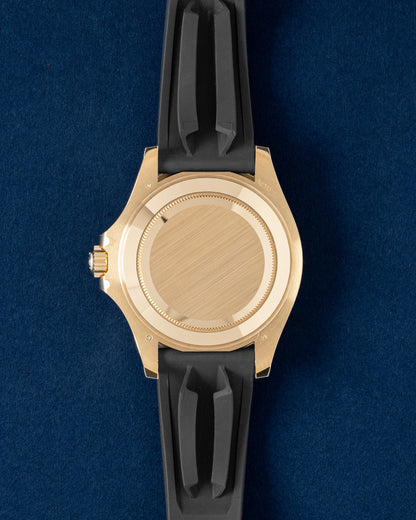Solid 18k yellow gold screw-down oyster caseback view of an unworn Rolex Yacht-Master 42mm luxury watch
