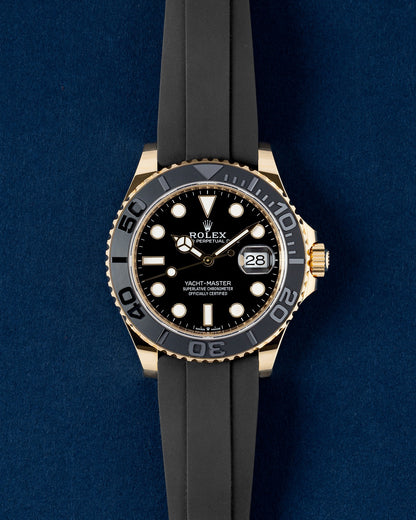 Brand new 2025 Rolex Yacht-Master 42 226658 in 18k yellow gold with black dial on Oysterflex strap at Grand Caliber Dallas