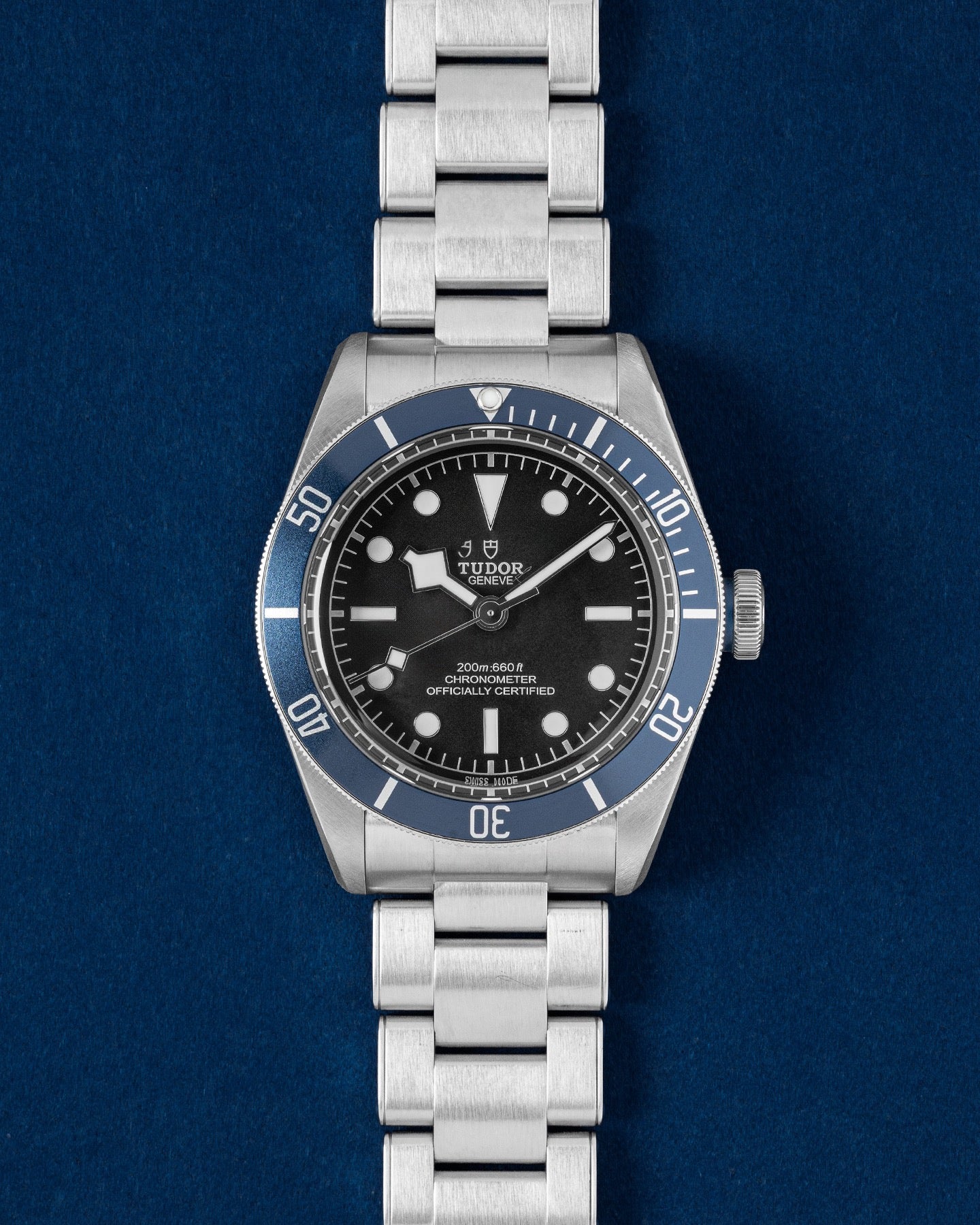 Tudor Black Bay 41 watch featuring a midnight blue aluminum bezel, matte black dial, silver Snowflake hands and a steel bracelet