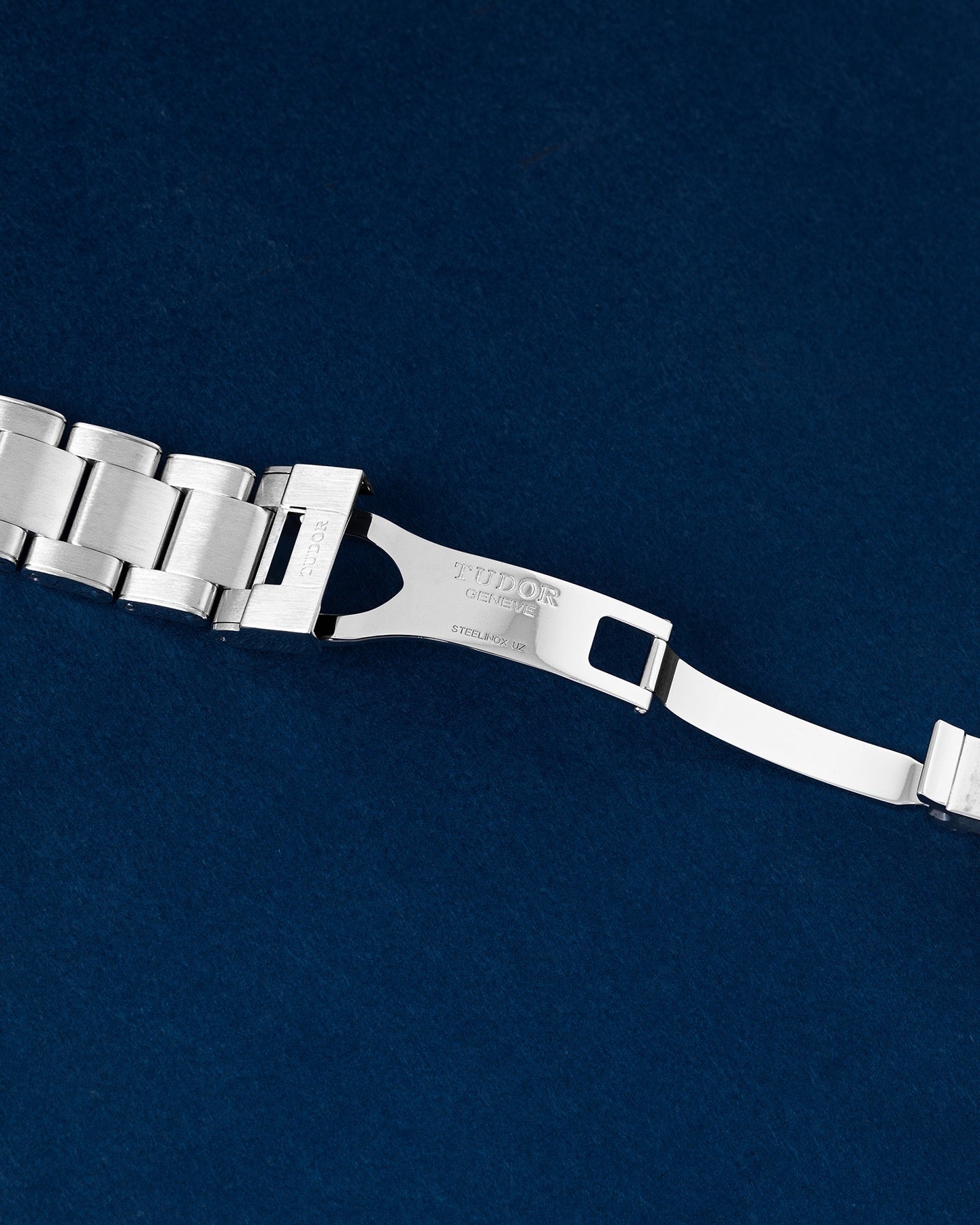 open stainless steel deployment safety clasp mechanism on a Tudor Black Bay 41 watch link bracelet