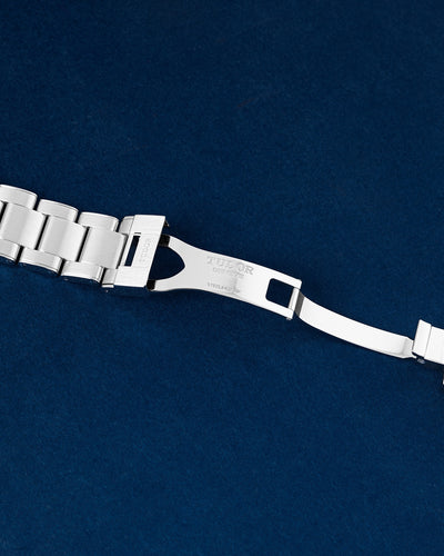 open stainless steel deployment clasp mechanism on a Tudor Black Bay bracelet