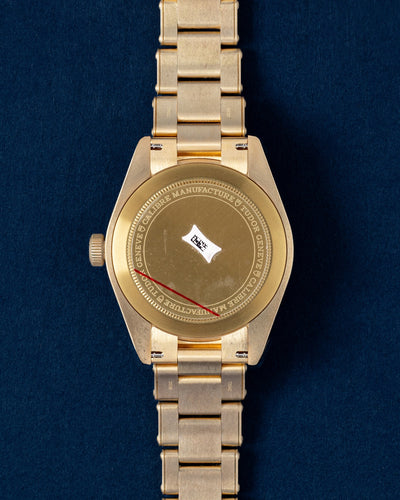 The reverse orientation of the bronze watch head highlighting the solid caseback detailed with Tudor factory engravings for the Tudor Black Bay Fifty Eight M79012M 0001 at Grand Caliber in Dallas, Texas