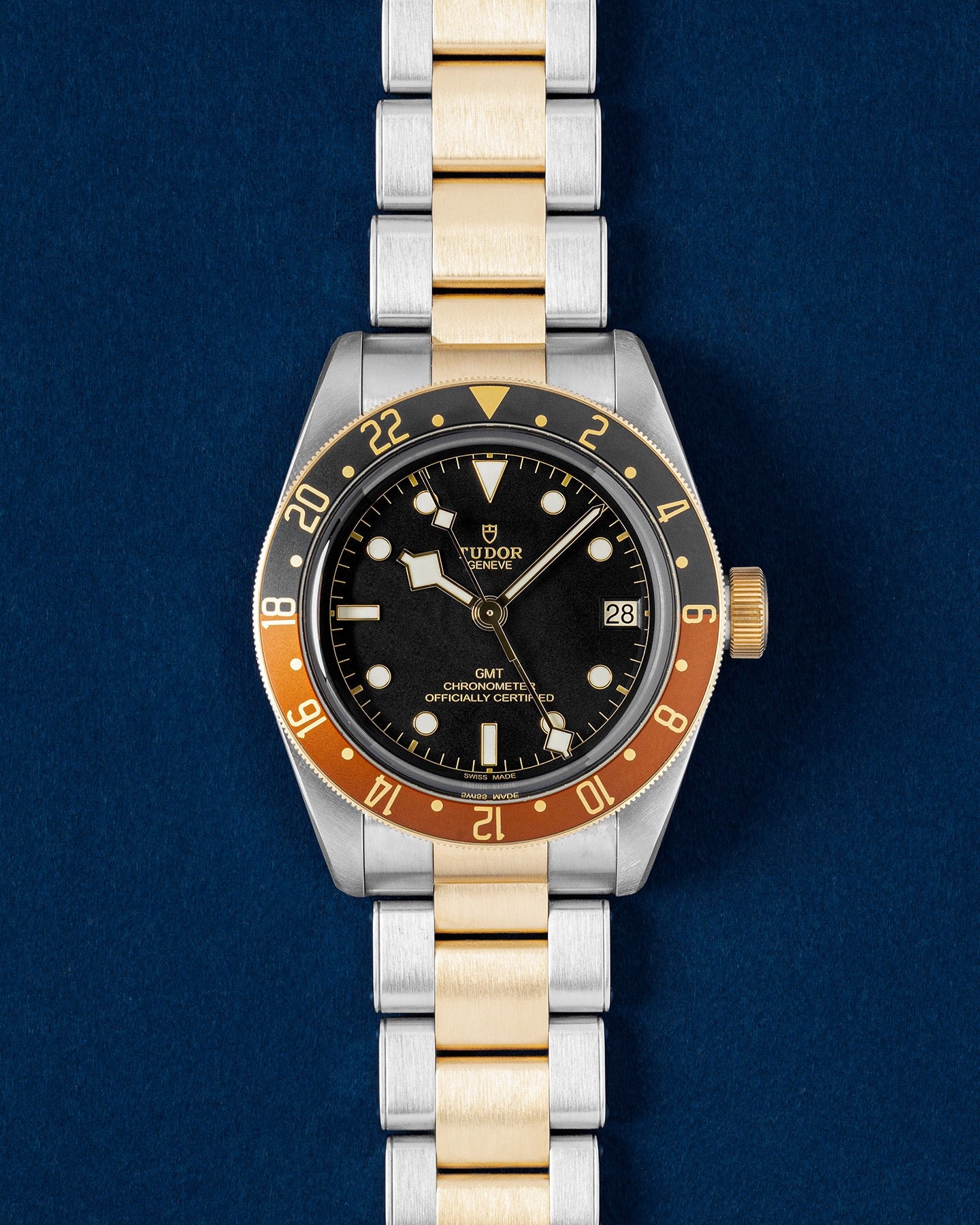 Tudor Black Bay GMT S and G Root Beer watch with a matte black dial, two tone brown and black bezel and gold-capped rivet bracelet
