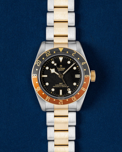 Tudor Black Bay GMT S and G Root Beer watch with a matte black dial, two tone brown and black bezel and gold-capped rivet bracelet