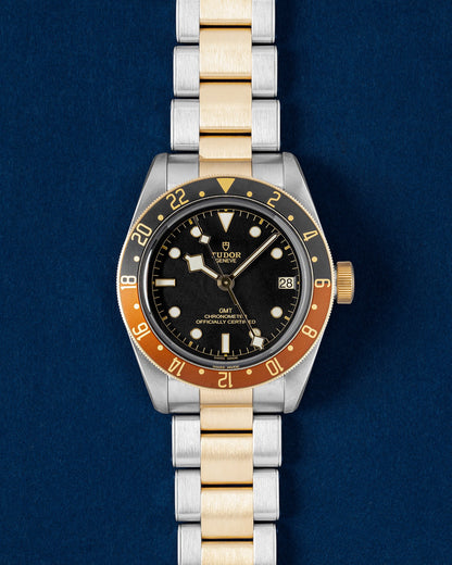 Tudor Black Bay GMT S and G Root Beer watch with a matte black dial, two tone brown and black bezel and gold-capped rivet bracelet