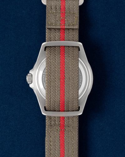 Solid steel screw-down caseback and unique fixed structural strap bars on a titanium Tudor Pelagos FXD tactical watch