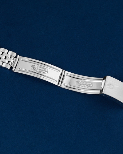 Detailed view of the open vintage folding deployment buckle section stamped with internal Rolex period-correct manufacturer hallmarks