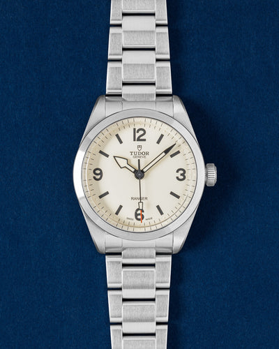 Tudor Ranger 39mm watch featuring a Dune white dial, painted Arabic numerals, a red-tipped seconds hand and a steel bracelet