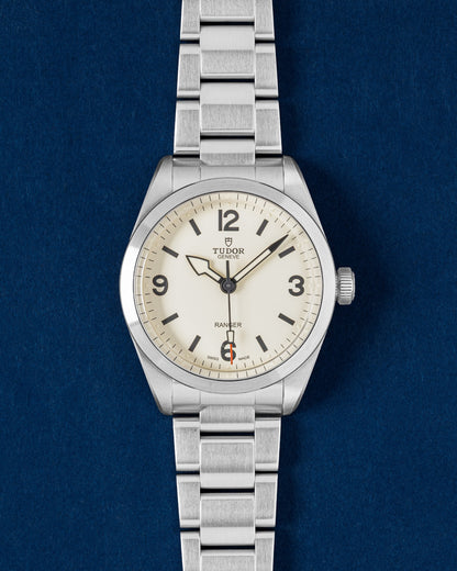Tudor Ranger 39mm watch featuring a Dune white dial, painted Arabic numerals, a red-tipped seconds hand and a steel bracelet