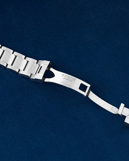 open stainless steel deployment safety clasp mechanism on a Tudor Ranger watch link bracelet
