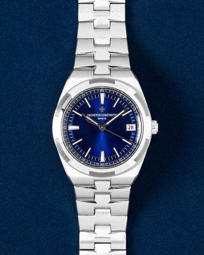 Vacheron Constantin Overseas watch featuring a translucent blue lacquered dial, signature Maltese Cross steel bezel and integrated bracelet