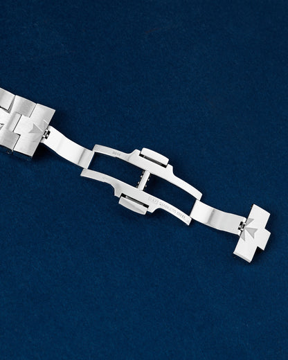 open stainless steel triple-blade folding deployment clasp showing the integrated micro-adjustment comfort system extension