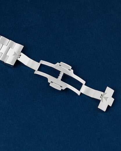 open stainless steel triple-blade folding deployment clasp showing the integrated micro-comfort adjustment sliders